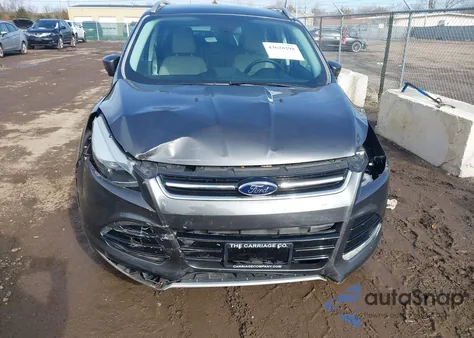 2016 Ford Escape Titanium z USA, uszkodzony, nr VIN 1FMCU9J9XGUA51989